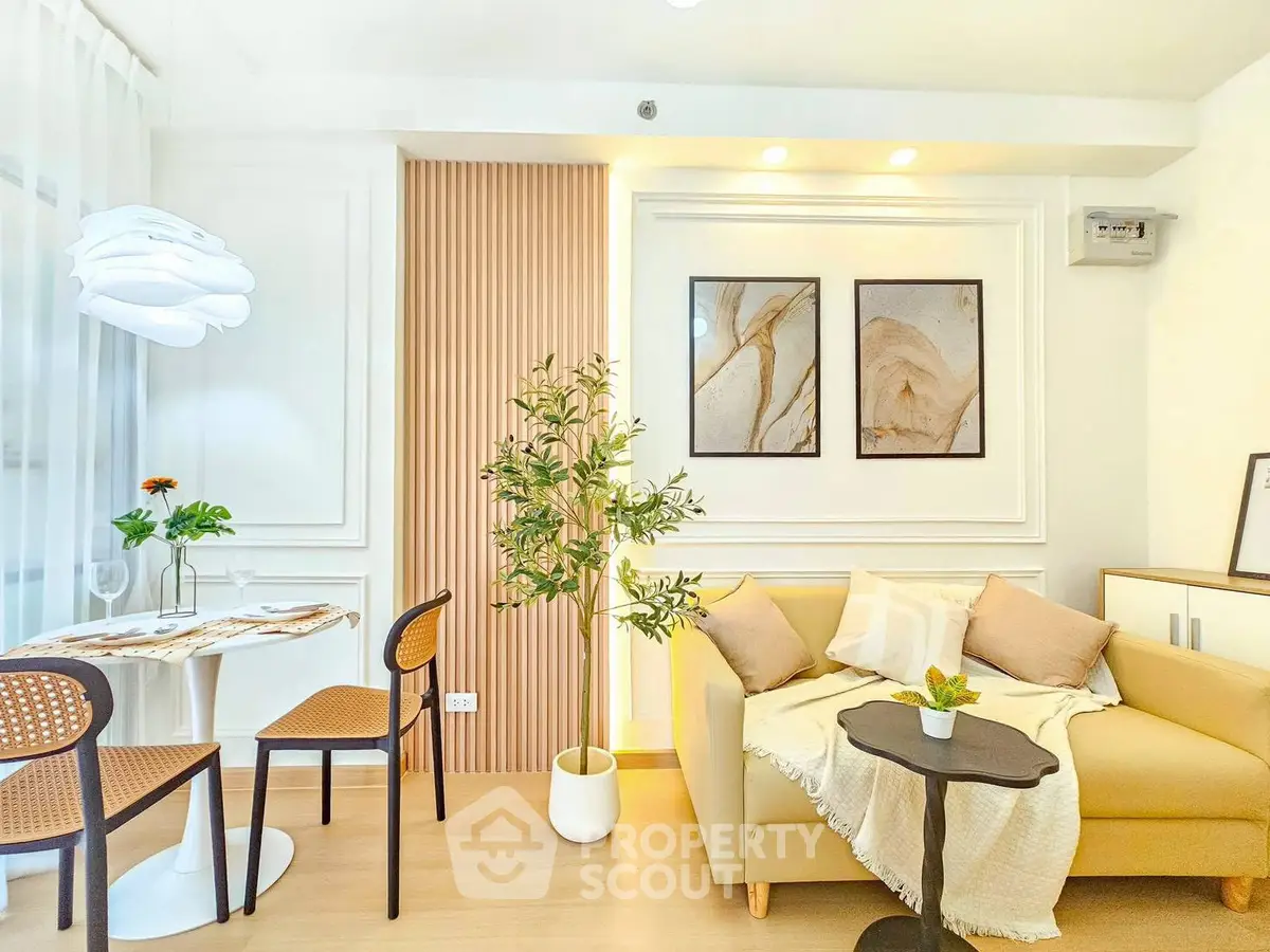 Stylish modern living room with cozy sofa and elegant dining area