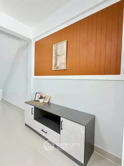 Modern interior with stylish console table and decorative wall paneling