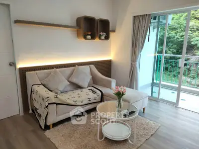 Cozy living room with modern decor and balcony view, perfect for relaxation and entertaining.