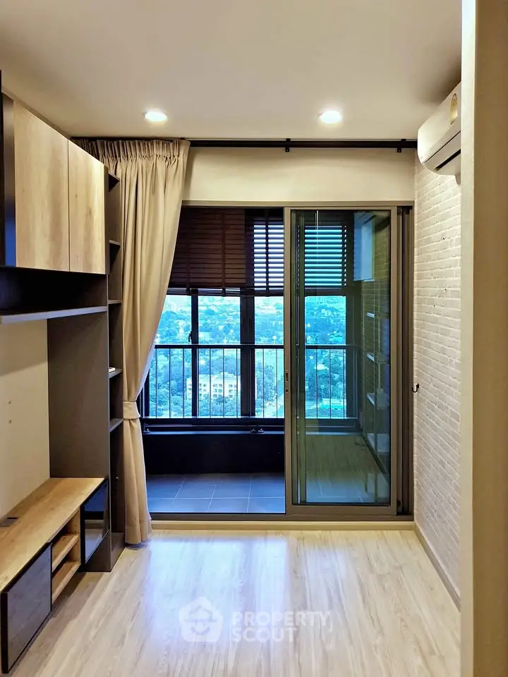 Modern living room with balcony and scenic view in high-rise apartment