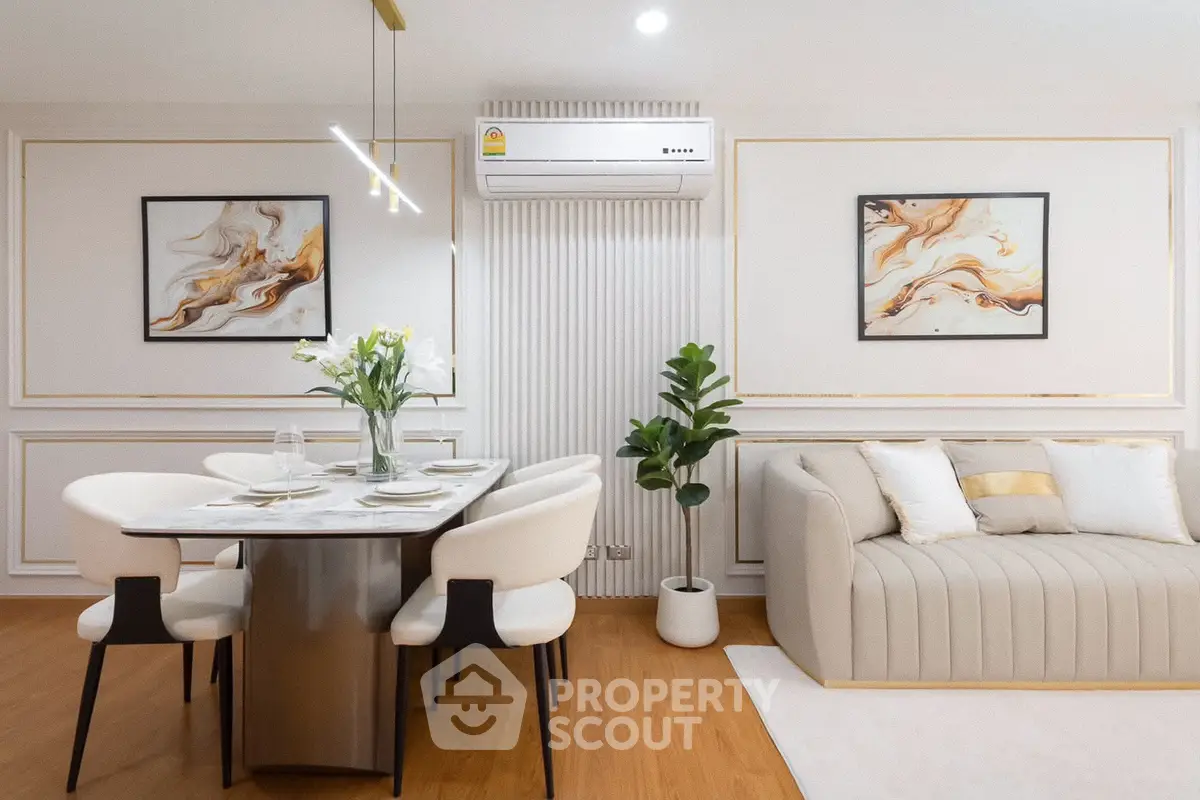 Elegant living room with modern dining area and stylish decor