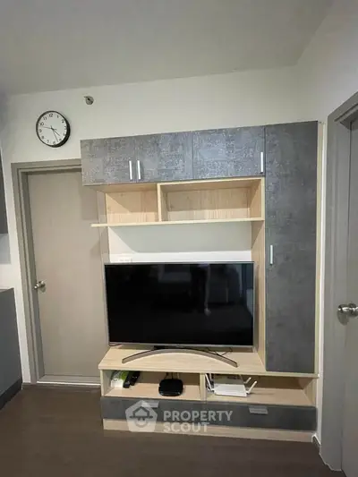 Modern living room with sleek TV unit and stylish storage cabinets