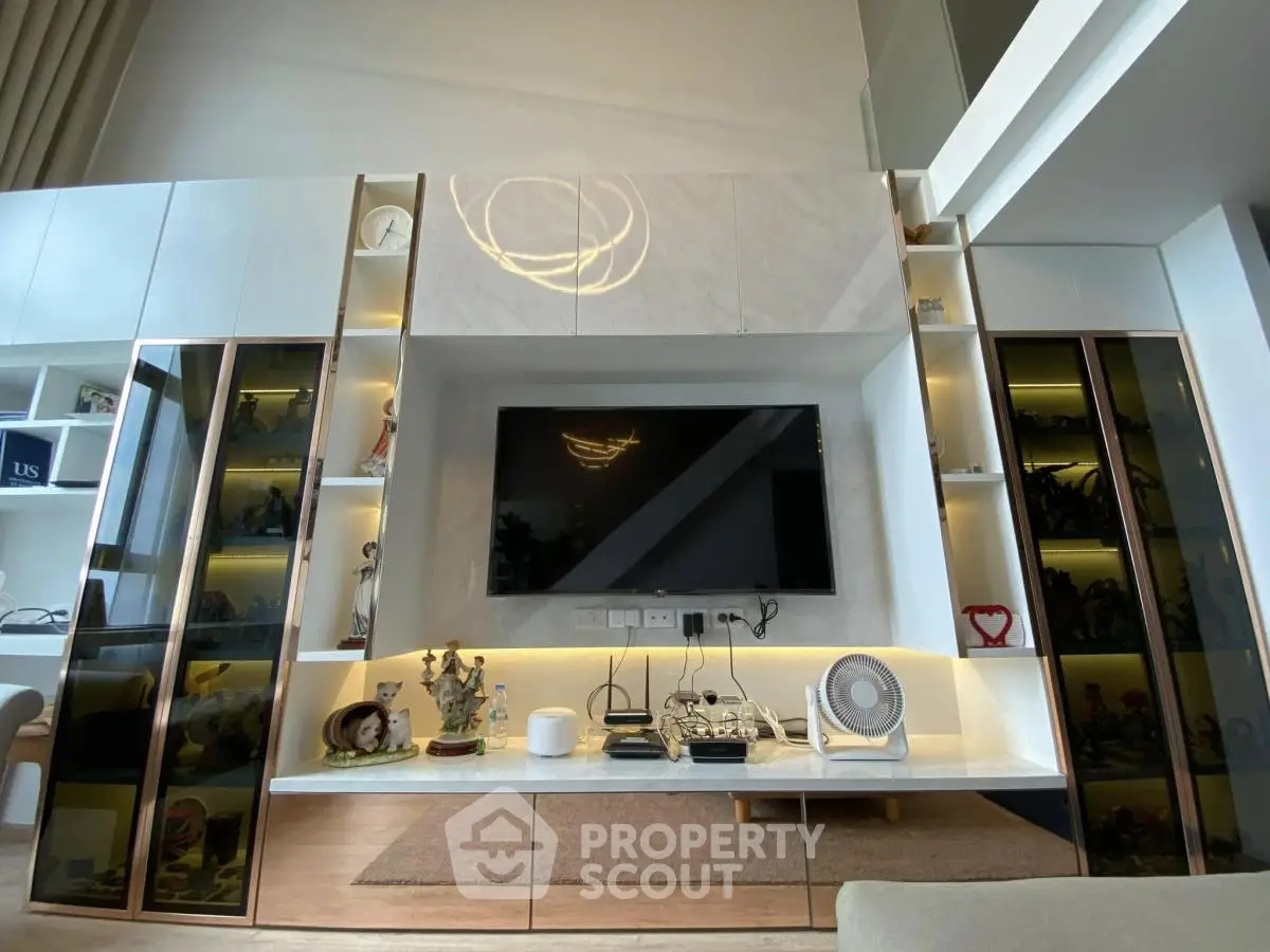 Modern living room with sleek built-in entertainment center and stylish decor