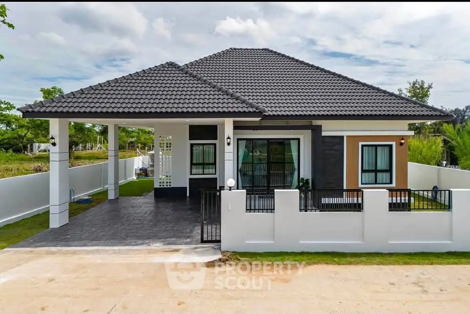 Modern single-story house with stylish roof and spacious driveway