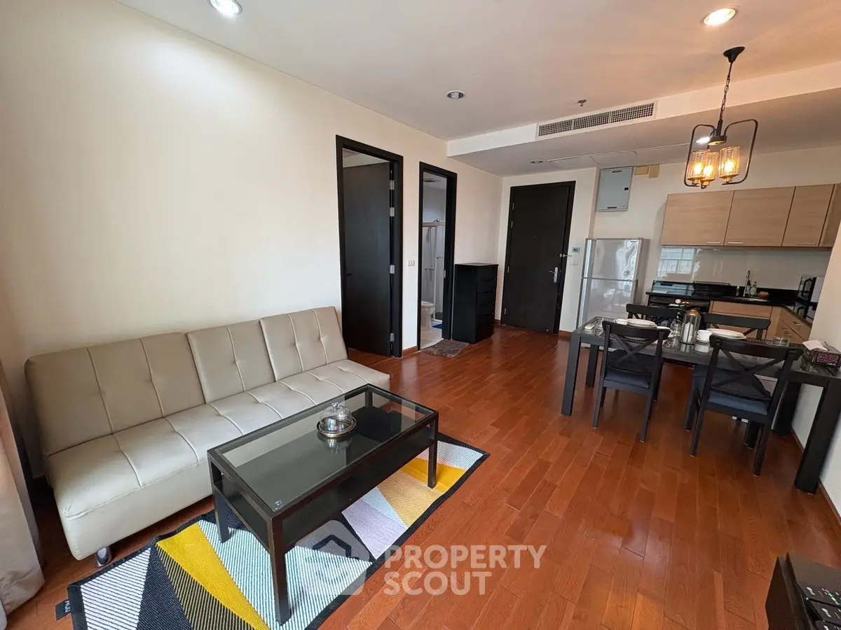 Modern living room with open kitchen and stylish furniture