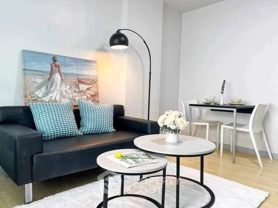 Chic modern living room with stylish decor and cozy dining area, perfect for urban living.