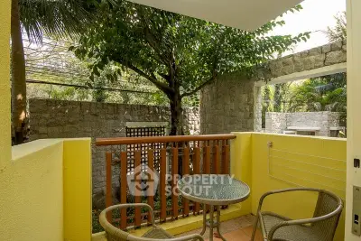 Charming balcony with garden view, perfect for relaxing outdoors.