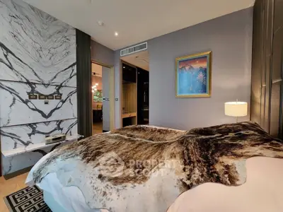 Luxurious bedroom with stylish decor and unique wall design