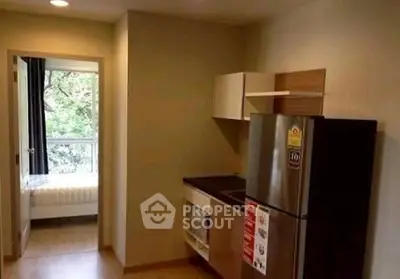 Cozy apartment kitchen with modern appliances and scenic window view