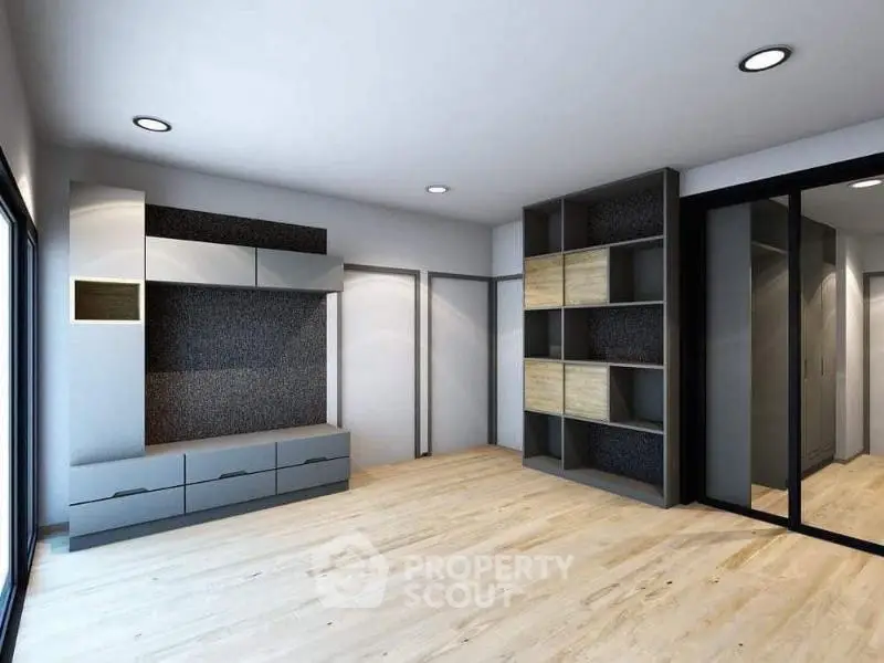 Spacious modern living room with sleek built-in storage and wooden flooring.