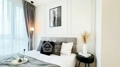 Modern bedroom with stylish decor and large window view