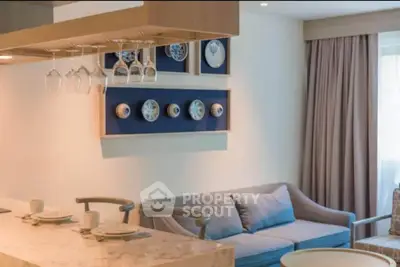 Stylish living room with modern decor and cozy seating area, perfect for relaxation and entertaining.