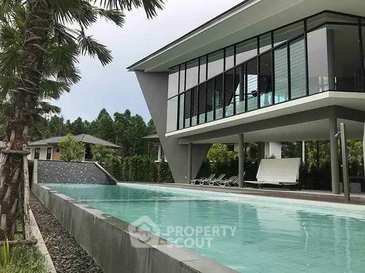 Luxurious modern home with stunning pool and sleek architectural design.