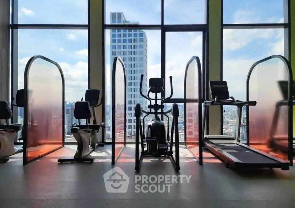 Modern gym with city view and state-of-the-art fitness equipment