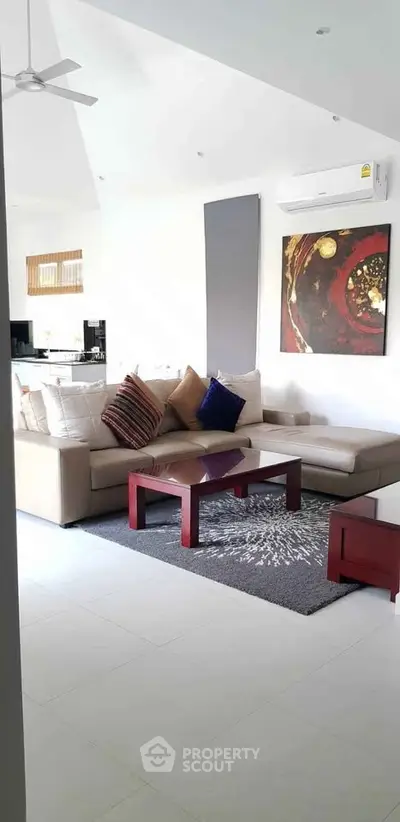 Stylish modern living room with cozy sectional sofa and contemporary art