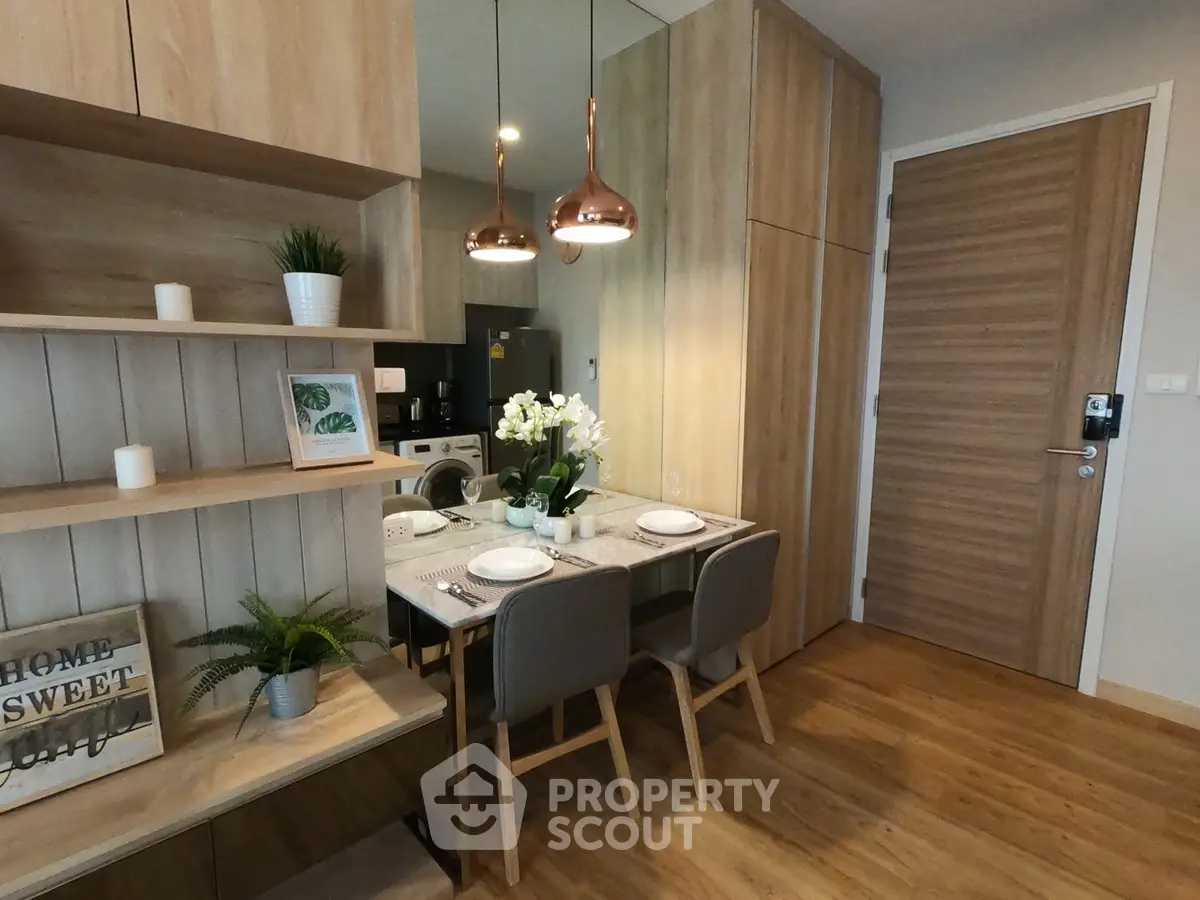 Modern dining area with wooden accents and stylish lighting in a cozy apartment.