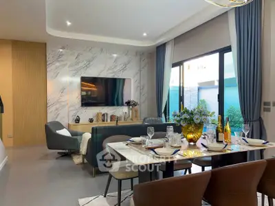 Luxurious modern living room with elegant dining area and large windows for natural light.