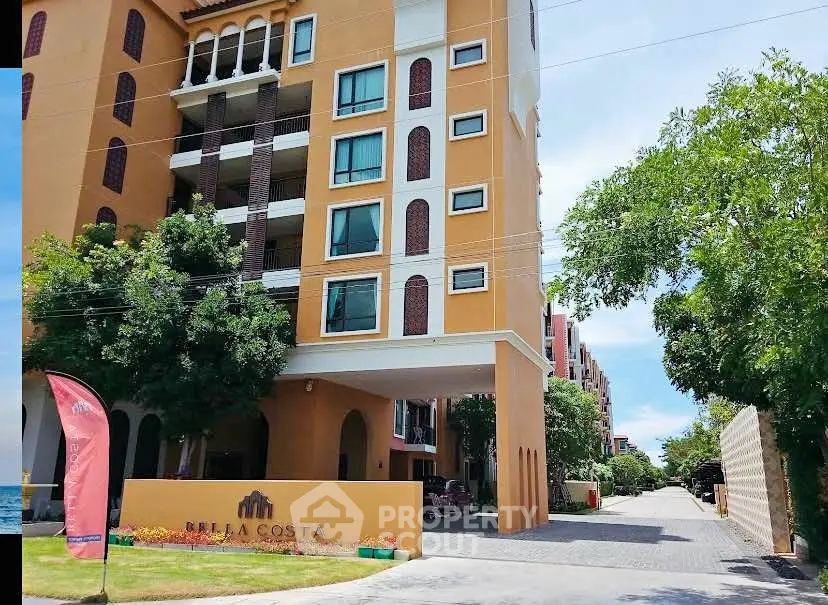 Stunning modern apartment building with lush greenery and spacious driveway