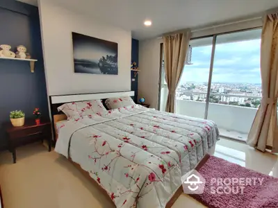 Modern bedroom with city view and floral bedding in high-rise apartment