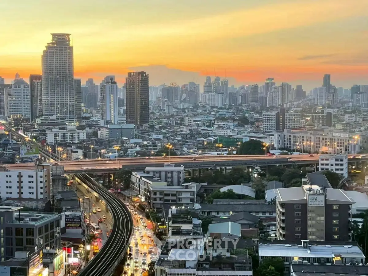 Stunning cityscape view at sunset with high-rise buildings and bustling streets, perfect for urban living enthusiasts.