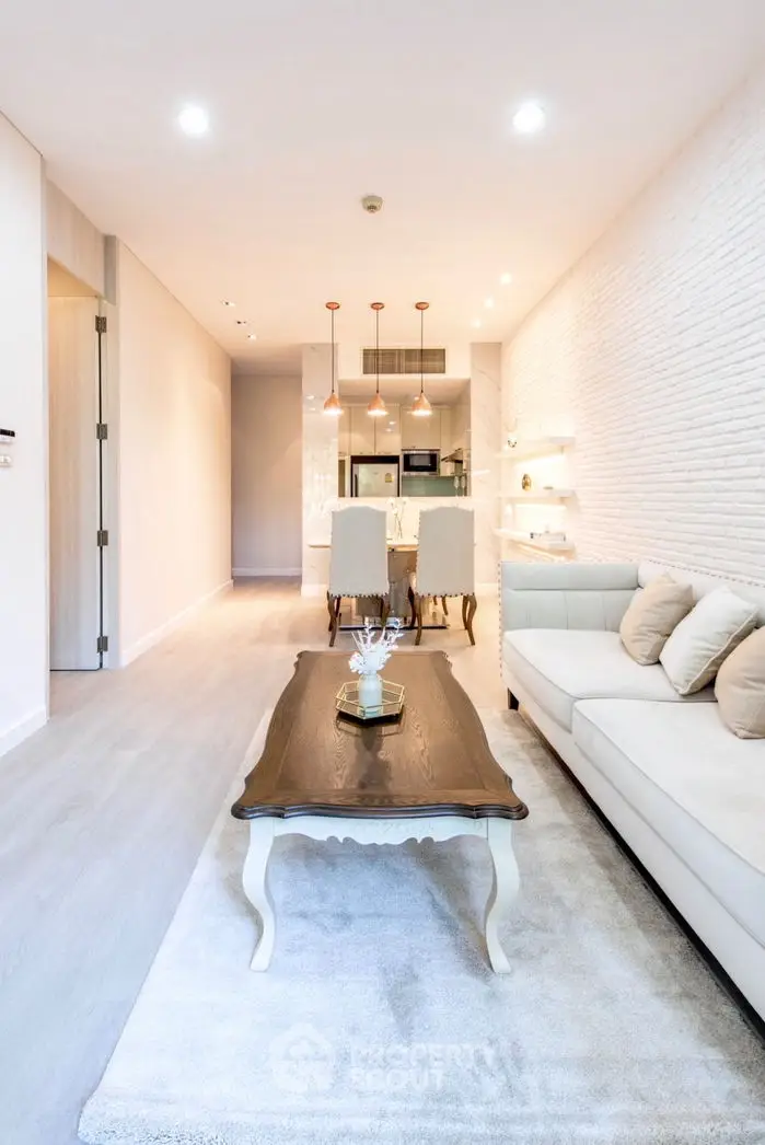 Modern living room with elegant decor and open kitchen layout