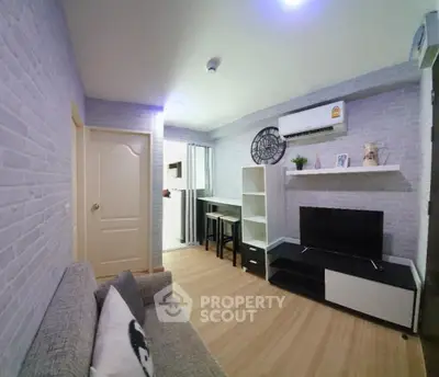 Modern living room with stylish decor and air conditioning in a cozy apartment.