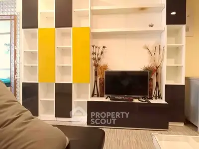 Modern living room with stylish shelving and TV setup