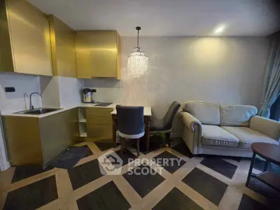 Stylish modern living room with open kitchen and elegant chandelier