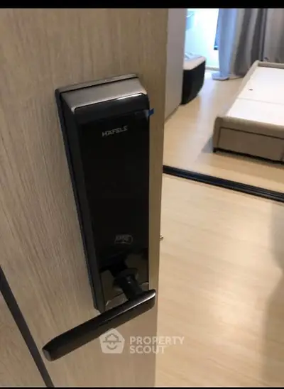 Modern bedroom with digital door lock and sleek wooden flooring