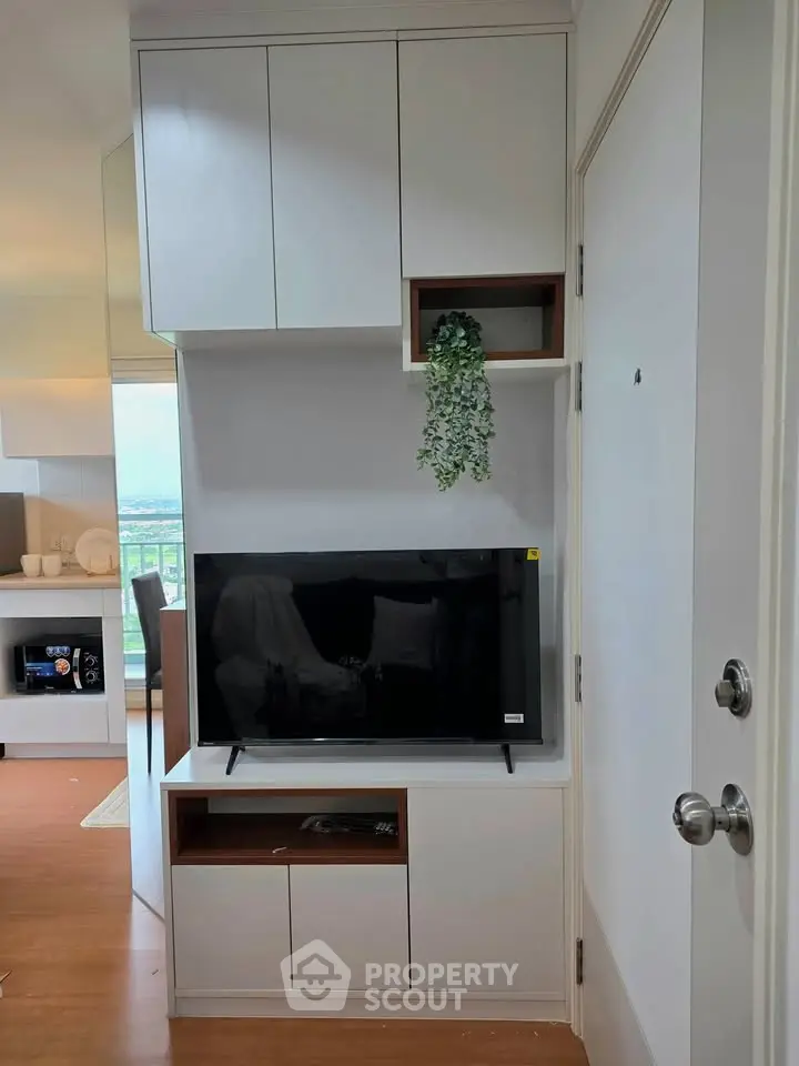 Modern living room with sleek TV unit and stylish cabinetry, perfect for contemporary urban living.