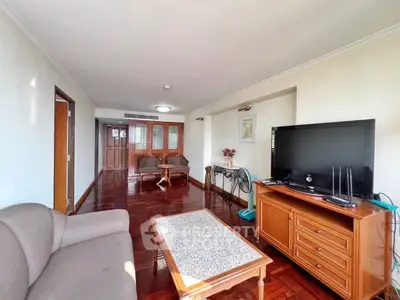 Spacious living room with elegant wooden flooring and modern furnishings