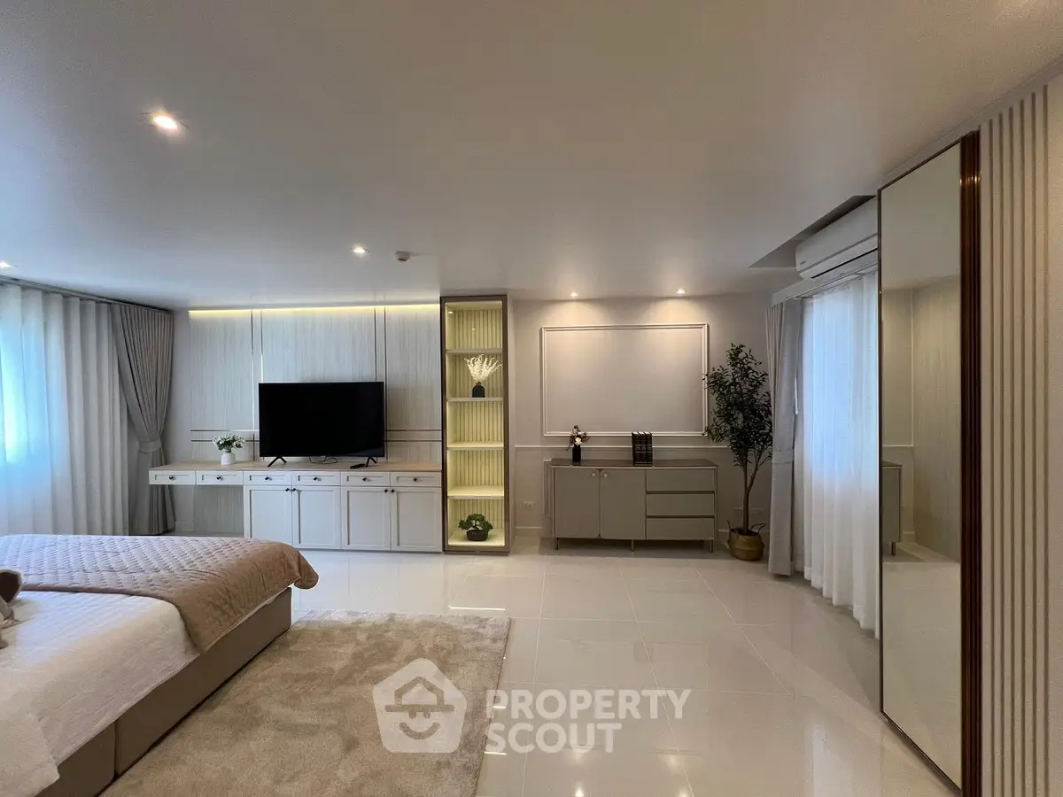 Luxurious modern bedroom with elegant decor and spacious layout