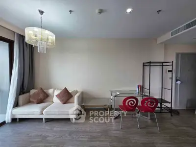 Modern living room with stylish chandelier and cozy seating area