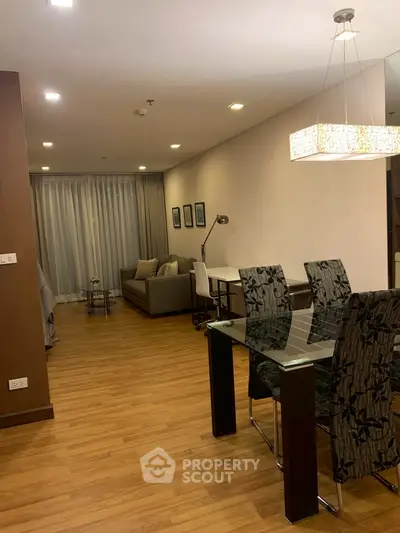 Spacious modern living room with elegant dining area and stylish lighting