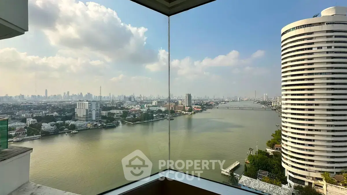 Stunning river and cityscape view from a high-rise building corner unit.