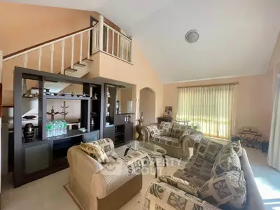 Spacious living room with elegant decor and natural light