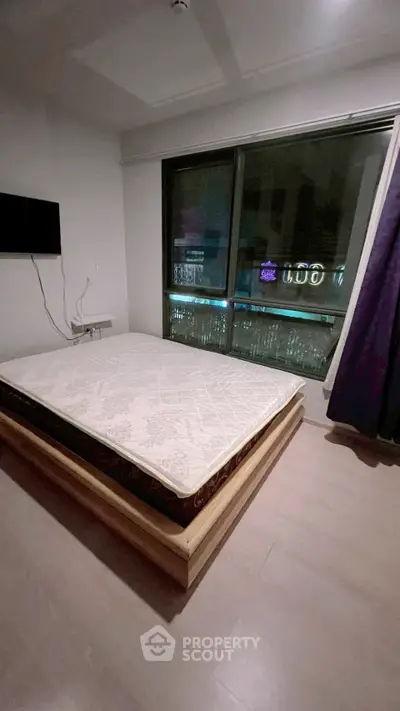 Modern bedroom with large window and minimalist decor