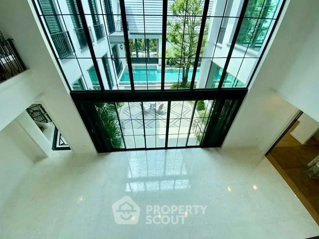 Luxurious modern building with stunning pool view and expansive windows