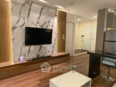Modern living room with stylish marble accent wall and sleek wooden flooring