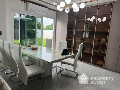 Luxurious dining room with marble table and modern lighting in a stylish home