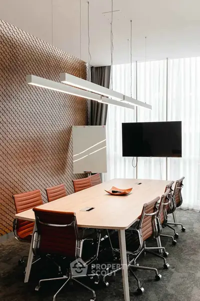 Modern conference room with sleek design and stylish furniture, perfect for professional meetings.
