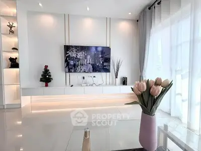 Modern living room with sleek TV setup and elegant decor