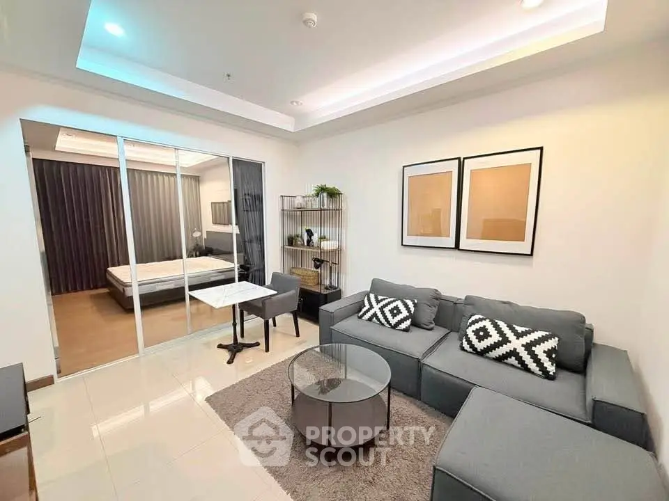 Modern living room with stylish decor and cozy seating in a contemporary apartment.