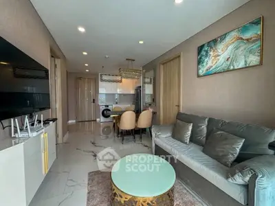 Modern living room with elegant decor and open kitchen layout