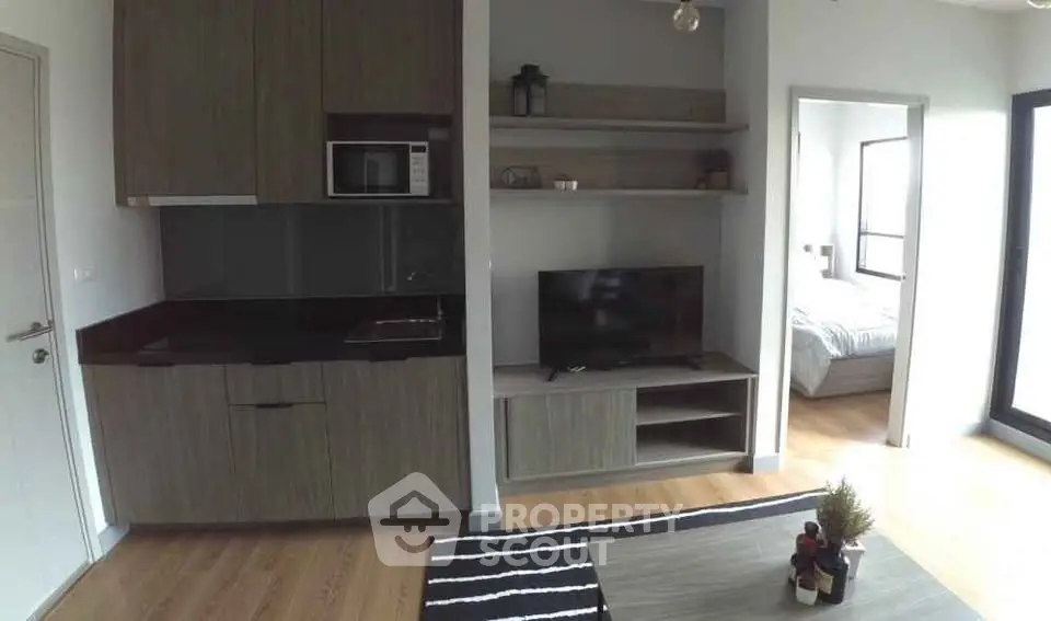 Modern apartment interior with open kitchen and cozy living area
