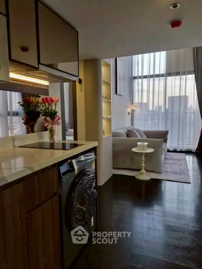 Modern open-layout living room with city view and stylish kitchen