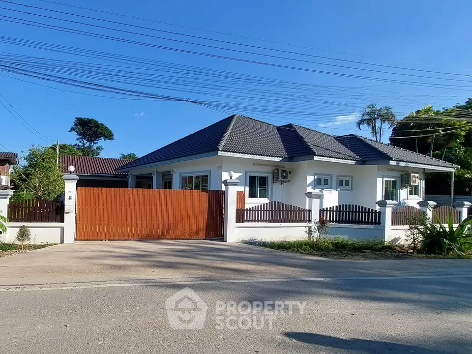 Charming single-story house with modern design and spacious yard in a serene neighborhood.