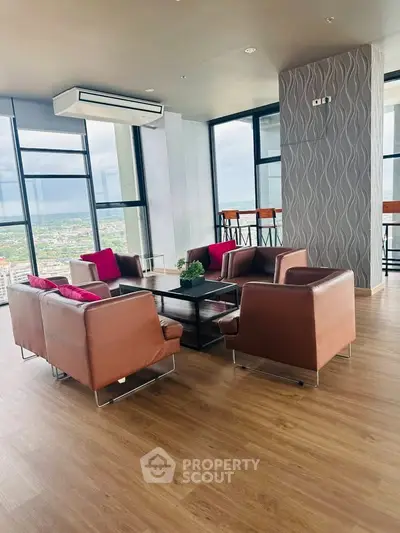 Luxurious high-rise living room with panoramic city views and modern furnishings.