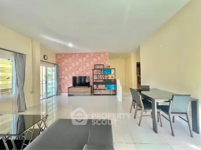 Spacious living room with modern decor and ample natural light