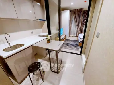 Modern compact kitchen with sleek design and open layout in a stylish apartment